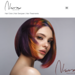 Woman with vibrant, multi-colored short hair styled elegantly.